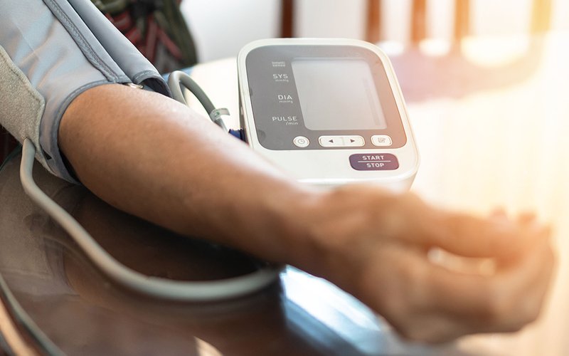 checking a patient's blood pressure